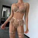 Необычный комплект бюстгальтеров и трусиков оптом из бежевой сетки с вышивкой